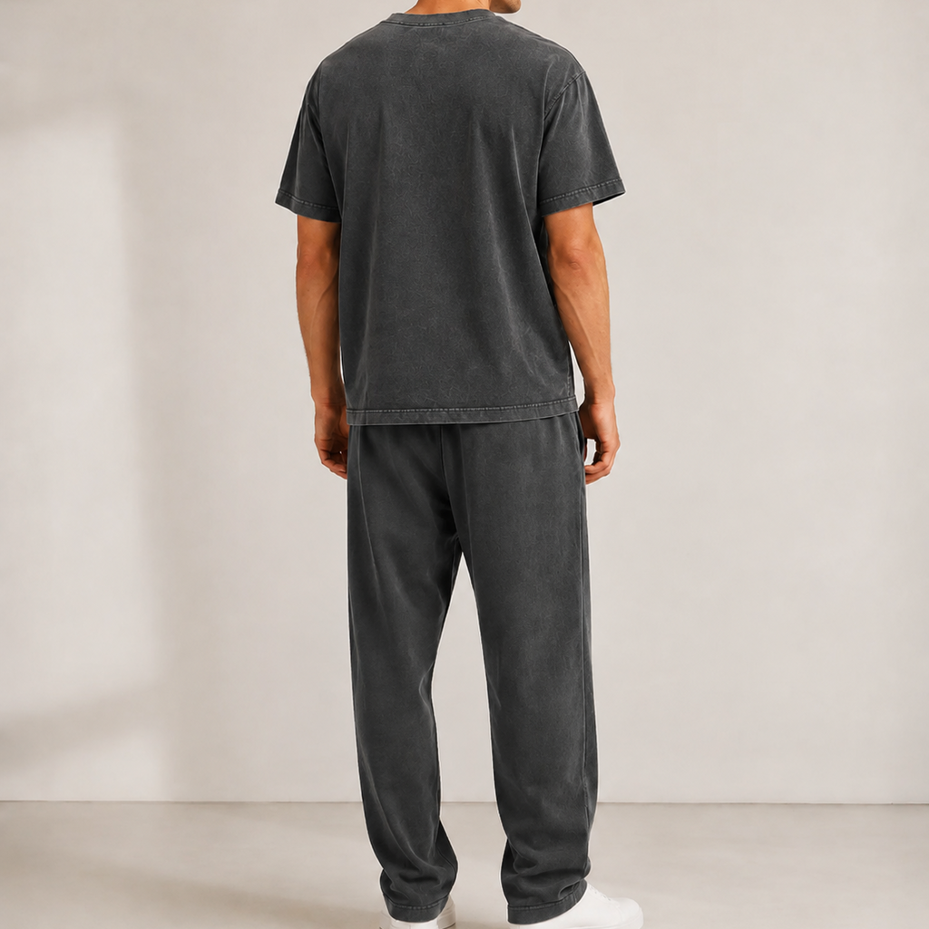 Back view of a model wearing the Vintage Washed T-Shirt with matching sweatpants and white sneakers